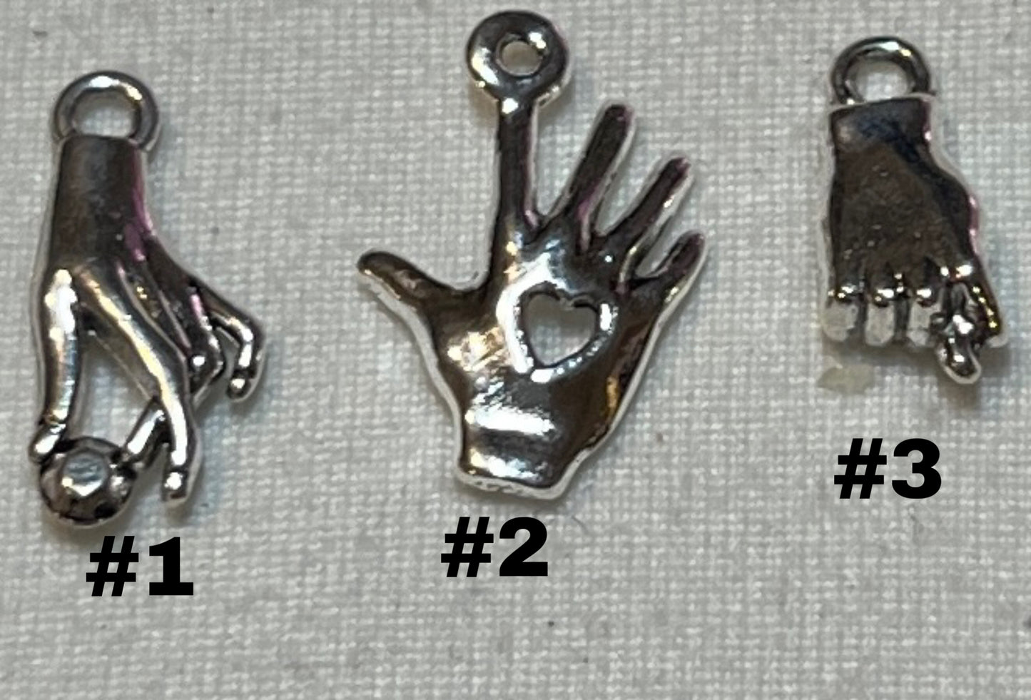 Hand signal charms
